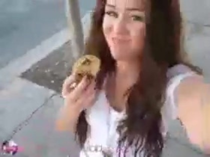   (299) - Miley Cyrus filming herself eating a big cookie - Captures