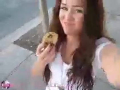   (300) - Miley Cyrus filming herself eating a big cookie - Captures
