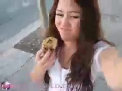   (304) - Miley Cyrus filming herself eating a big cookie - Captures