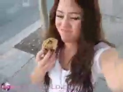   (305) - Miley Cyrus filming herself eating a big cookie - Captures