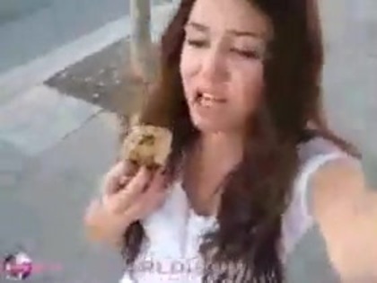   (322) - Miley Cyrus filming herself eating a big cookie - Captures