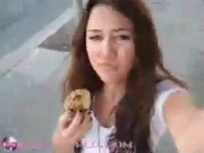   (339) - Miley Cyrus filming herself eating a big cookie - Captures