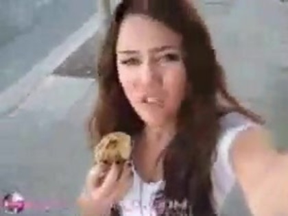   (341) - Miley Cyrus filming herself eating a big cookie - Captures