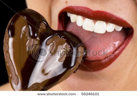 stock-photo-a-beautiful-young-woman-biting-into-a-chocolate-heart-56246101