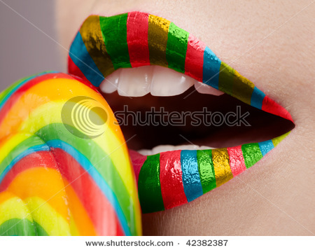stock-photo-close-up-of-beautiful-girl-s-lower-part-of-face-and-lollipop-42382387 - Buze