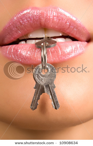 stock-photo-close-up-of-woman-s-lips-with-keys-10908634 - Buze