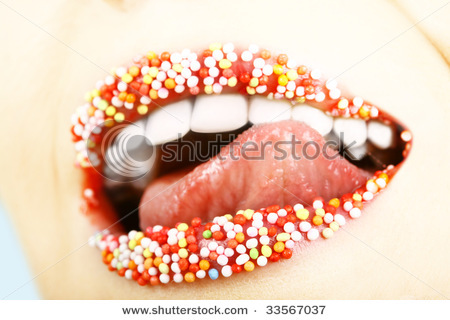 stock-photo-close-up-of-woman-tongue-and-lips-with-multicolored-pearls-33567037