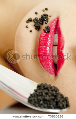 stock-photo-detail-of-woman-with-black-caviar-73530526 - Buze