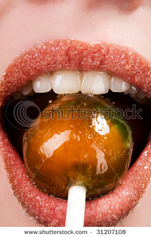 stock-photo-pretty-girl-lips-sucking-lollipop-closeup-31207108