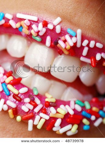 stock-photo-womans-lips-with-colored-candy-48739978 - Buze1