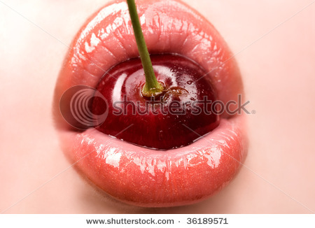 stock-photo-young-woman-mouth-with-red-cherry-closeup-36189571 - Buze1