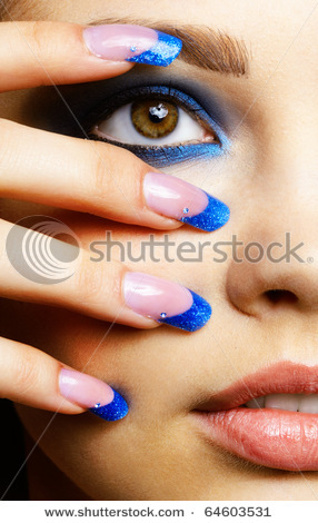 stock-photo-close-up-portrait-of-beautiful-brunette-with-blue-eye-shadow-make-up-and-manicure-646035