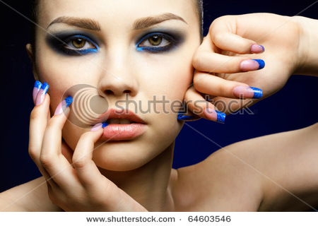 stock-photo-close-up-portrait-of-beautiful-brunette-with-blue-eye-shadow-make-up-and-manicure-646035