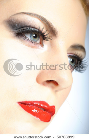 stock-photo-young-elegant-beauty-female-face-with-red-shiny-lips-and-black-eye-makeup-colse-up-50783 - Make-up