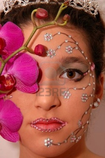 665926-girl-wearing-makeup-made-of-rhinestone-flowers-with-a-pink-orchid - Machiaj fantasy1