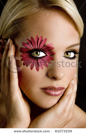 stock-photo-beautiful-model-with-dramatic-flower-makeup-61073239