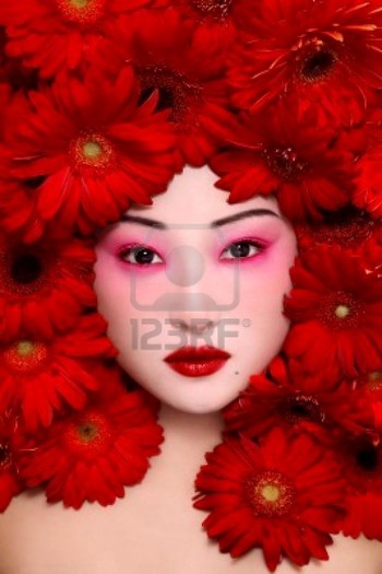 stock-photo-beautiful-young-asian-girl-with-stylish-make-up-and-red-flowers-around-face-51213631m