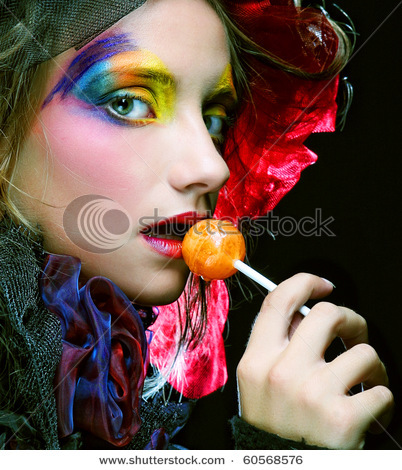 stock-photo-girl-with-with-creative-make-up-holds-lollipop-doll-style-60568576