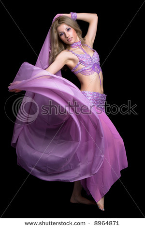 stock-photo-attractive-girl-dances-east-dance-isolated-on-a-black-background-8964871