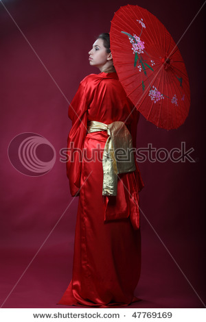 stock-photo-beautiful-brunette-girl-in-a-japanese-kimono-with-umbrella-47769169