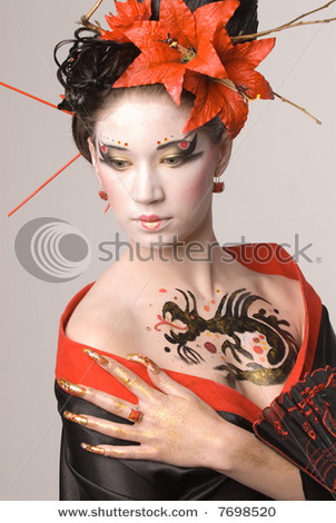 stock-photo-the-young-japanese-woman-on-a-grey-background-7698520