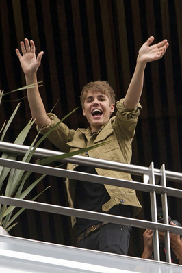  - 2011 Waving to fans from his hotel balcony in Mexico October 1st