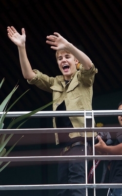  - 2011 Waving to fans from his hotel balcony in Mexico October 1st