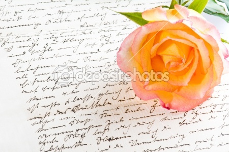 dep_4548318-Red-yellow-rose-over-a-hand-written-love-letter