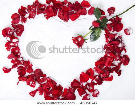 stock-photo-heart-drawn-in-the-snow-and-decorated-with-red-rose-and-petals-45058747