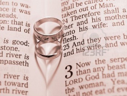 4553485-gold-wedding-bands-lying-on-a-page-of-the-bible-forming-shadow-hearts - Together forever