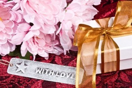 5379679-close-up-of-white-gift-box-with-ribbon--pink-flowers-and-with-love-tag