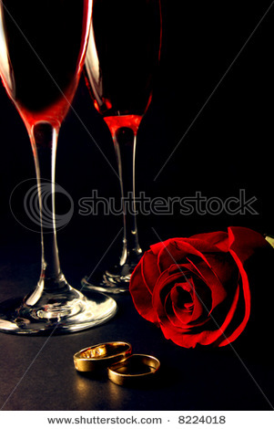 stock-photo-wedding-rings-rose-and-champagne-glasses-over-black-8224018 - Together forever