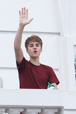  - 2011 Waving to fans from hotel balcony in Rio De Janerio Brazil October 4th