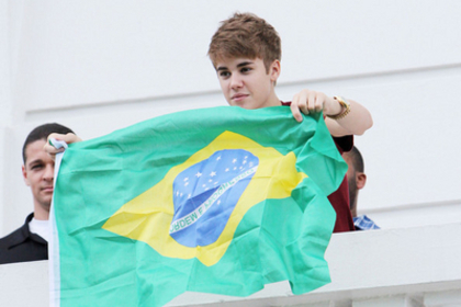  - 2011 Waving to fans from hotel balcony in Rio De Janerio Brazil October 4th