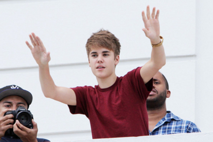  - 2011 Waving to fans from hotel balcony in Rio De Janerio Brazil October 4th