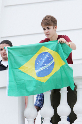  - 2011 Waving to fans from hotel balcony in Rio De Janerio Brazil October 4th