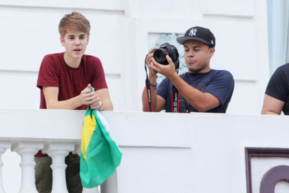  - 2011 Waving to fans from hotel balcony in Rio De Janerio Brazil October 4th