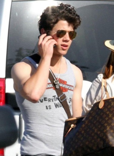 nick-jonas-harley-tank-top-12-530x728 - nick jonas