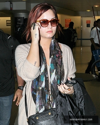 Demi (2) - Demi - December 10 - Arrives at the Miami International Airport