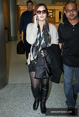 Demi (8) - Demi - December 10 - Arrives at the Miami International Airport