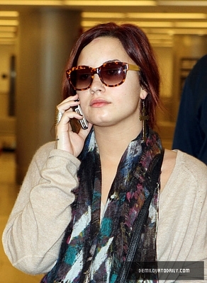 Demi (21) - Demi - December 10 - Arrives at the Miami International Airport