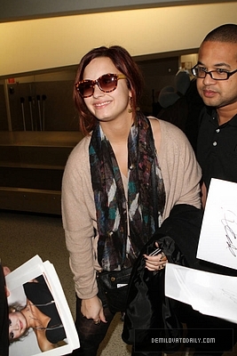 Demi (33) - Demi - December 10 - Arrives at the Miami International Airport