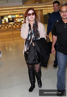 Demi (43) - Demi - December 10 - Arrives at the Miami International Airport