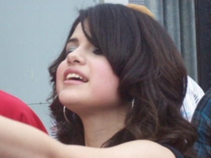 normal_selena-gomez-mobbed_(8) - Taking Pictures with fans outside the House of Blues in Dallas Texas - November 28th