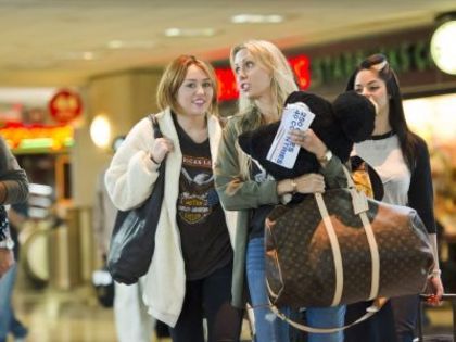 6 - Miley Cyrus At LAX Departing To Ecuador