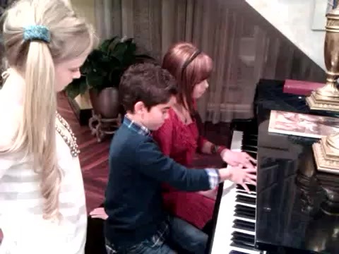 Debby Ryan gives Cameron a quick piano lesson 001