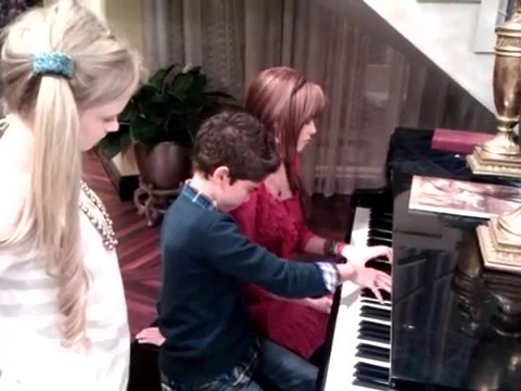 Debby Ryan gives Cameron a quick piano lesson 009