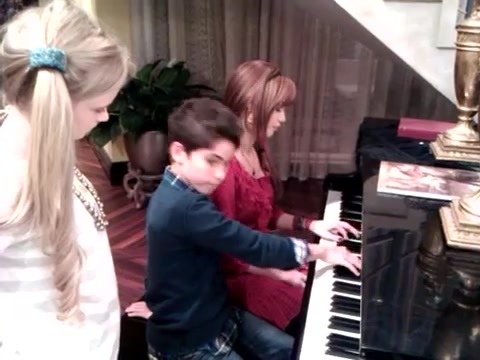 Debby Ryan gives Cameron a quick piano lesson 011