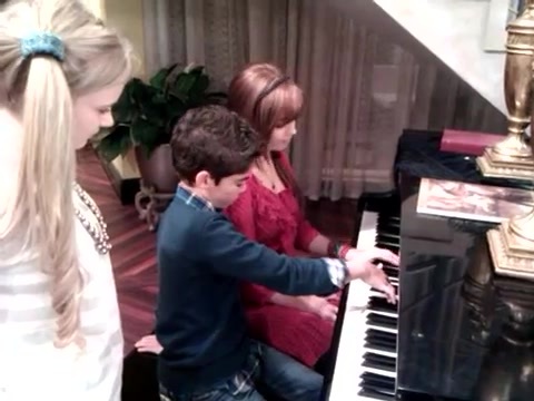 Debby Ryan gives Cameron a quick piano lesson 020