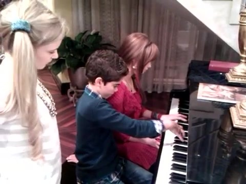 Debby Ryan gives Cameron a quick piano lesson 025